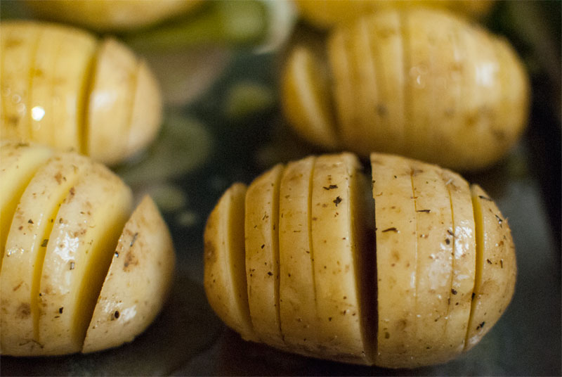 Baked Hasselback potatoes with raclette cheese